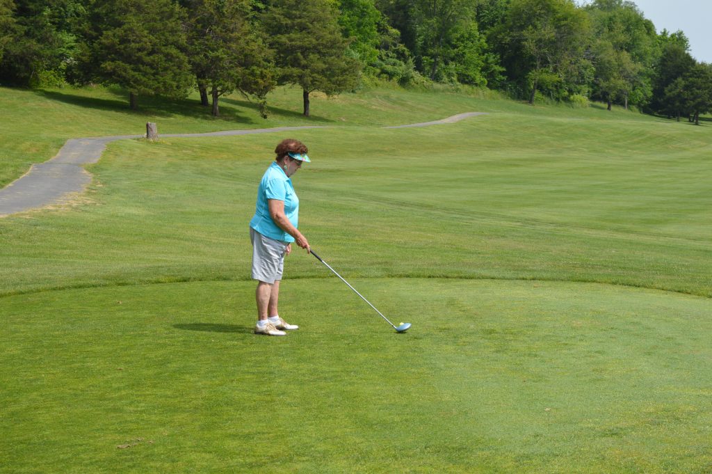 woman playing golf